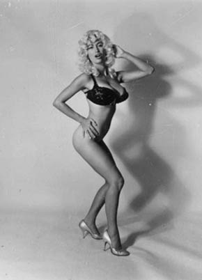 Kellie Everts. More Jayne Mansfield than Jayne Mansfield. Barely there black bra and panties Kellie with platinum blonde perm.